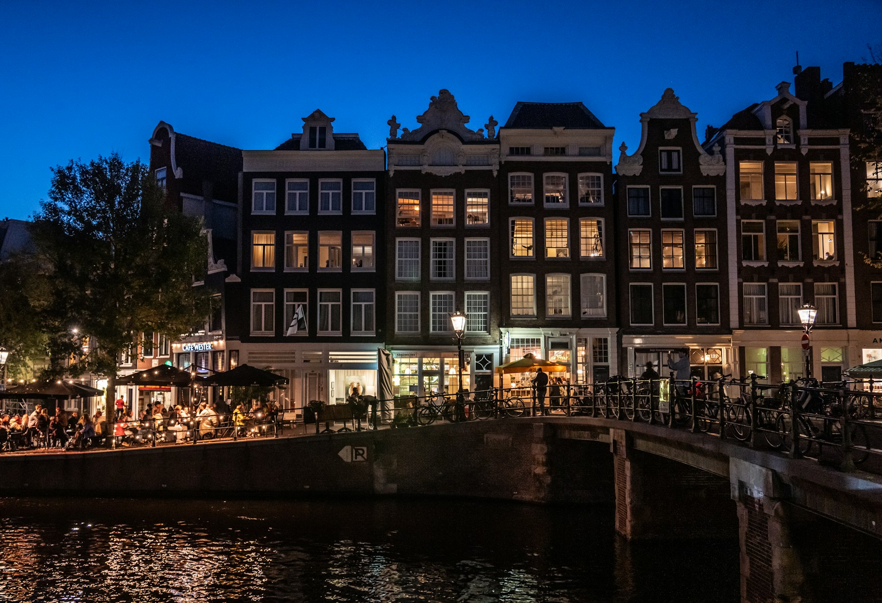Amsterdam canal houses and water at dusk