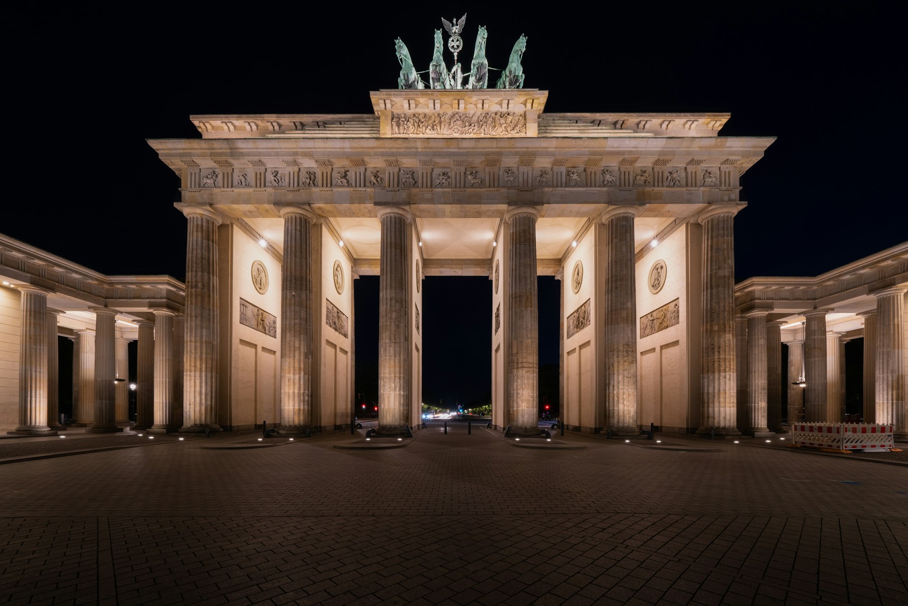 Brandenburg Gate illuminated at night in Berlin