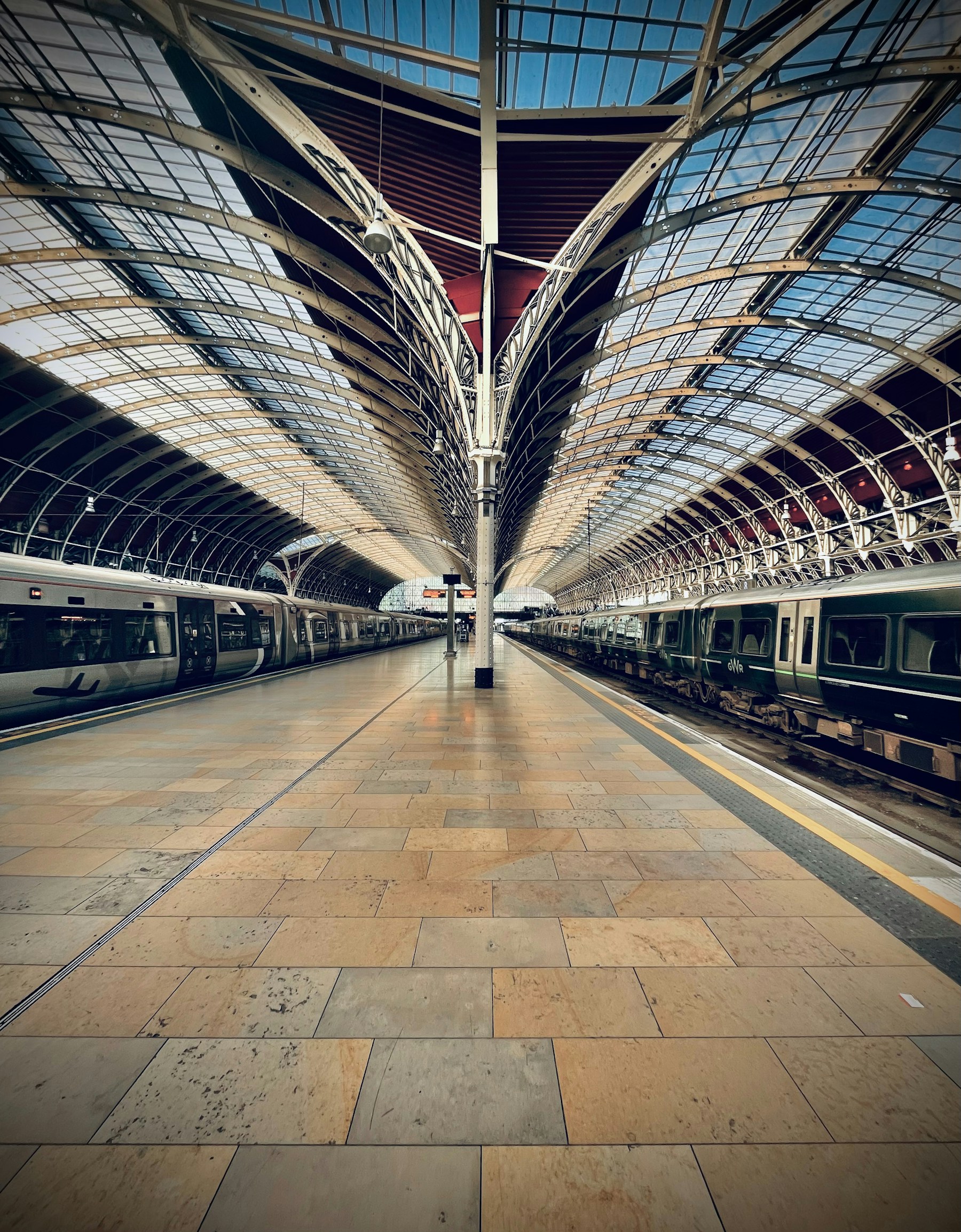 Paddington Station platforms beneath the arched glass roof