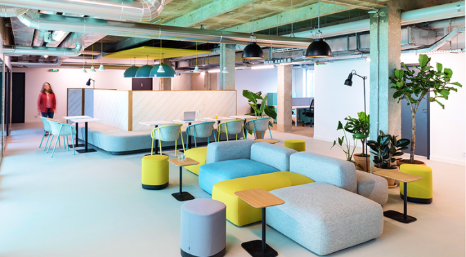 A flexible modern workspace with lounges, desks, and collaborative zones.